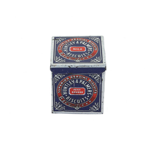 A vintage miniature Huntley & Palmers biscuit tin box with red, blue, and white detailing, featuring the brand's logo.