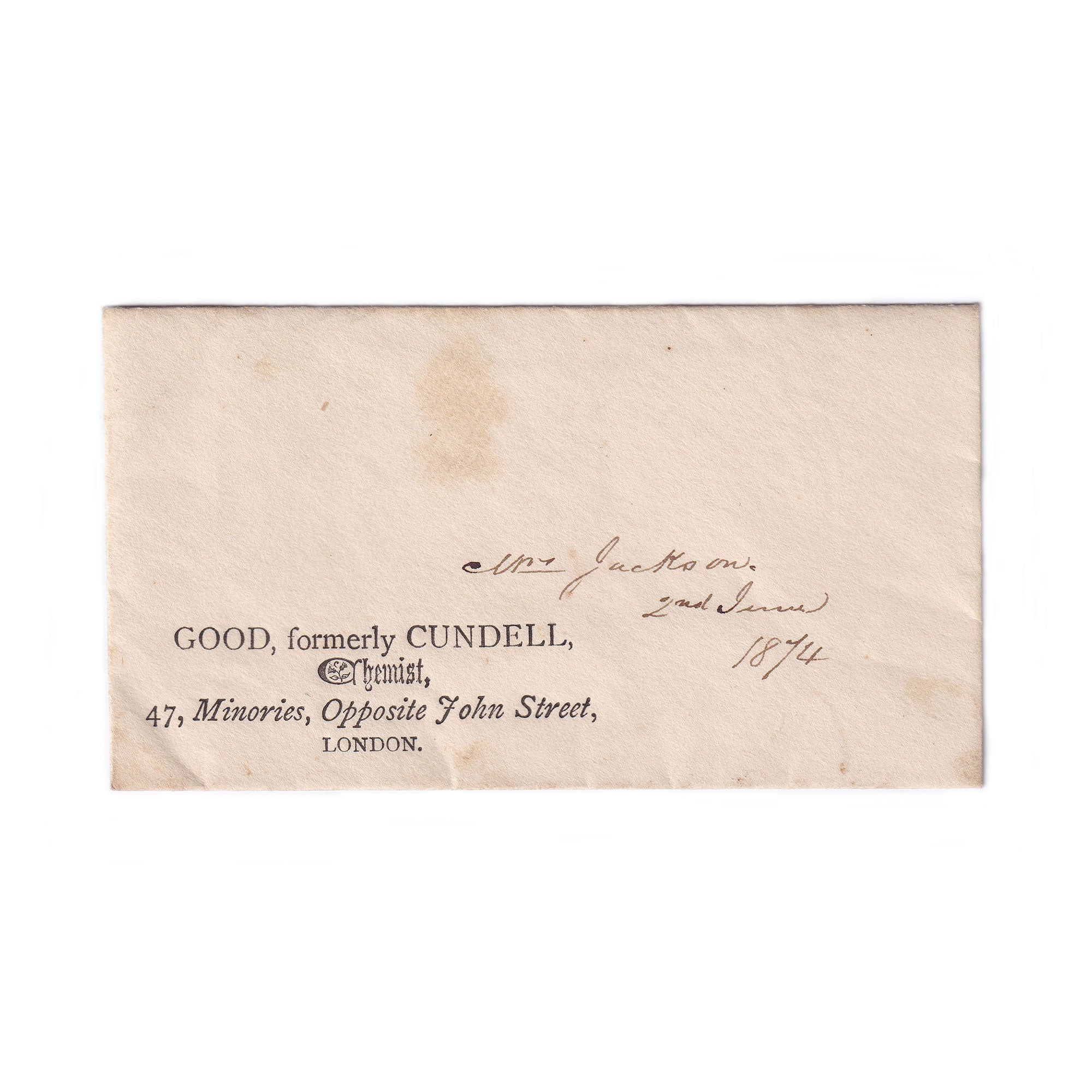 A small beige envelope for a prescription with a stamp on the back, addressed to a Mrs Jackson, dated 1874, with visible signs of aging.