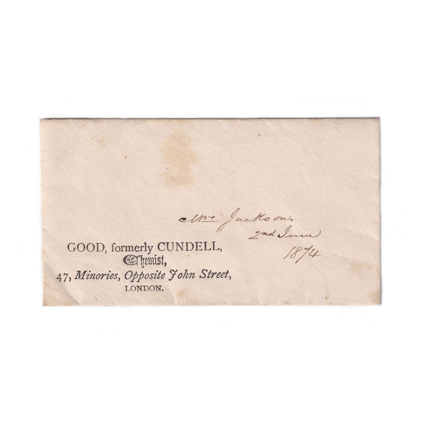 A small beige envelope for a prescription with a stamp on the back, addressed to a Mrs Jackson, dated 1874, with visible signs of aging.