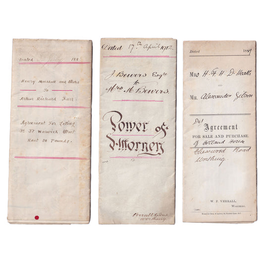 Three old legal deeds and a Power of Attorney written on paper, dated 1883-1912, with handwritten and printed text, folded up.