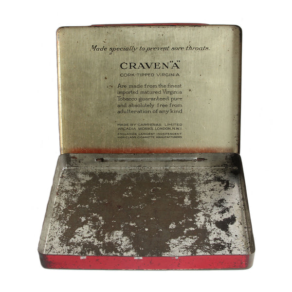 A metal Craven A secondhand tin red and black and cream which is open showing signs of wear