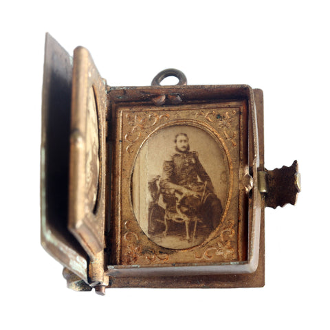 A miniature antique old brass photo album with a gentleman portrait