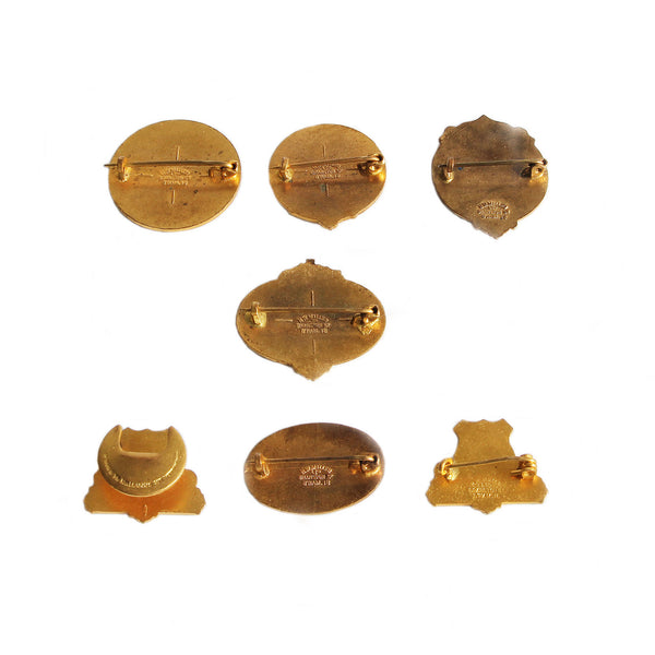 A selection of vintage reverses of brass pin badges of bowling clubs