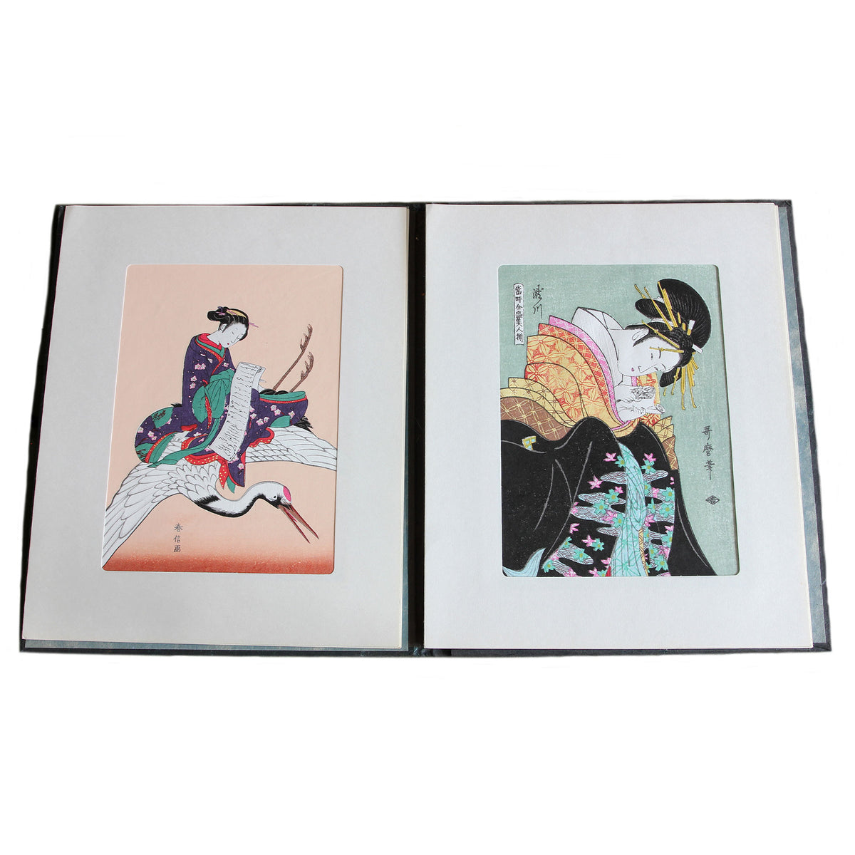 A beautiful set of secondhand japanese wood block prints in colour showing portraits of women dated circa 1950s in a book