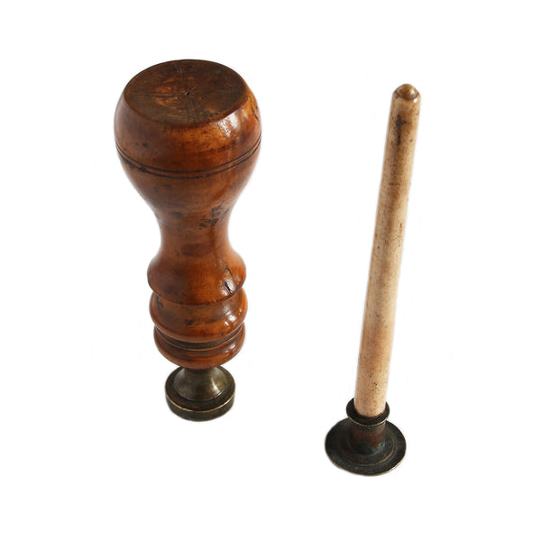 bone and wooden sealing wax stamps standing next to each other